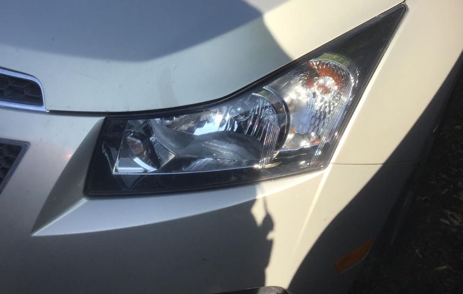 Used OEM Driver side Chrome Bezel Head Light fits 2011-2012 Chevrolet Cruze 95900041