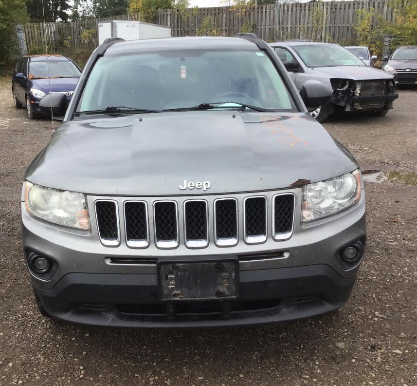 Used OEM Driver Side Chrome Bezel Head Light fits 2011-2014 Jeep Compass Grand Cherokee 68088869AC
