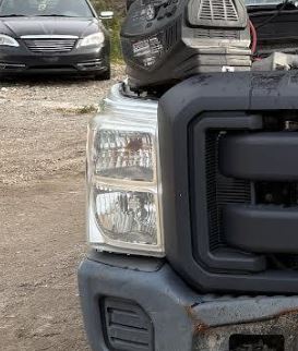 Used OEM RH Passenger Side Headlight fits 2011-2016 Ford F250SD/F350SD Pickup