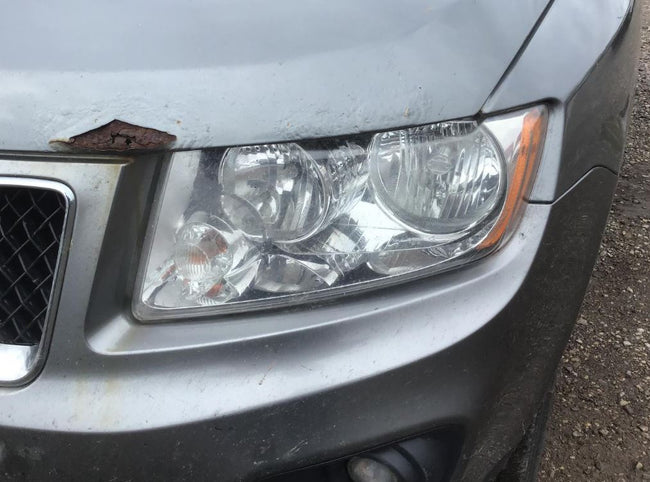 Used OEM Driver Side Chrome Bezel Head Light fits 2011-2014 Jeep Compass Grand Cherokee 68088869AC