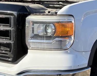 Used OEM LH w/out LED Accent Headlight fits 2014-2015 Sierra 1500, 2015 Sierra 2500/3500 GM23130717
