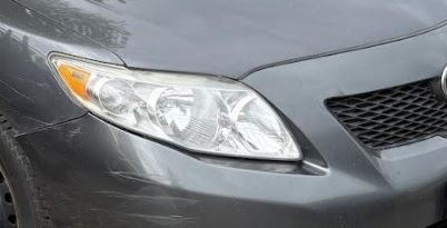 Used OEM RH Passenger side Headlight w/o black trim fits 2009-2010 Toyota Corolla 8111002670
