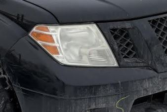 Used OEM RH Headlight fits 2009-2021 Nissan Frontier 26010ZL40B 26010ZL40A